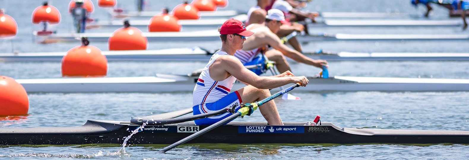 Athletes rowing WinTech Racing boat